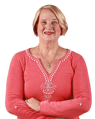 Pam, a real person taking Wegovy, smiles at the camera with crossed arms. She is light-skinned and feminine-presenting.​
