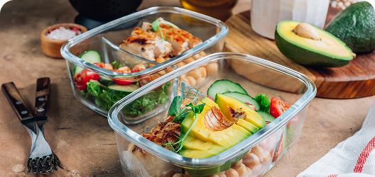 Containers filled with healthy prepared meals.